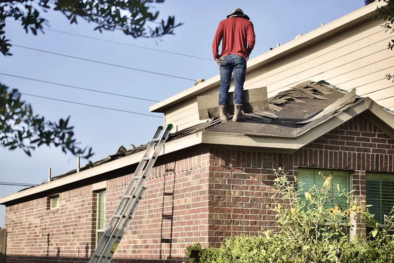 Professional roofer working on a residential roof in Mount Joy
